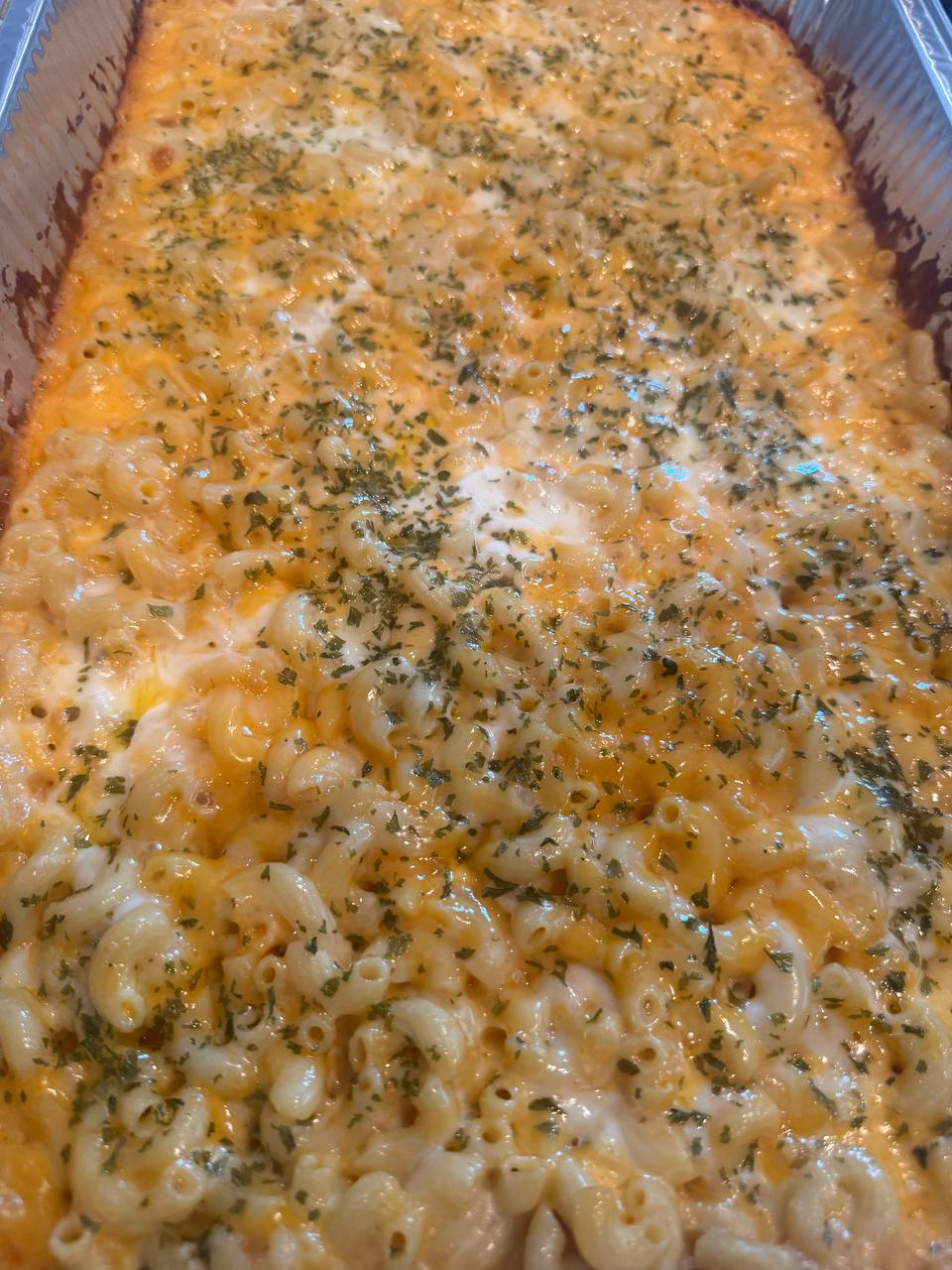 Tray of golden baked mac and cheese from Go Hard Grills